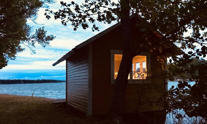 Saltsjo Boo House | Cottage with sunny wooden deck by water