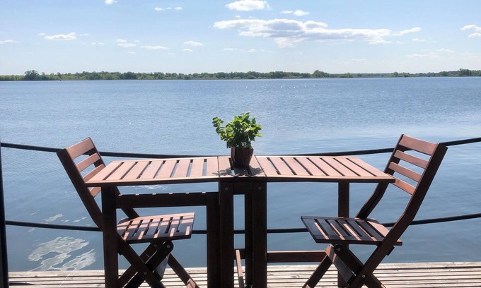 Plaue Boat Rental | Cozy and romantic houseboat in a prime location with fireplace and sauna.