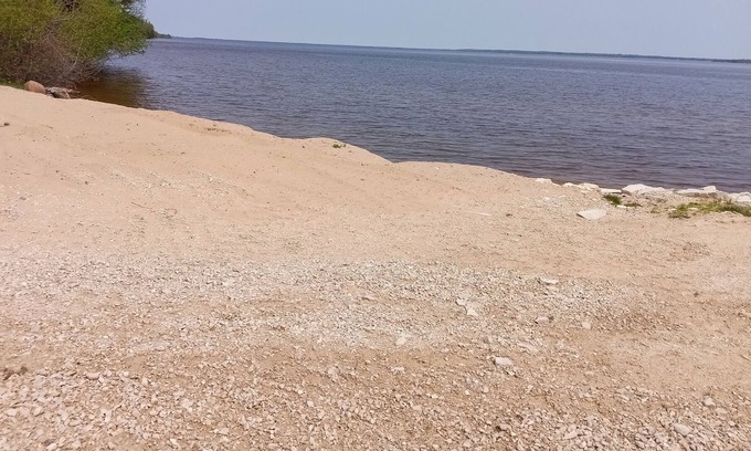 Manistique House | Cozy accommodations on Indian Lake with small sand beach.