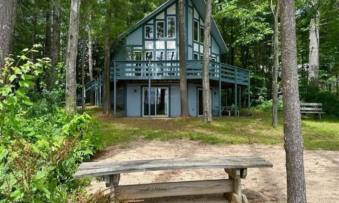 Elmira Cottage | Cozy beachfront cottage in the woods with walkout basement and wrap-around porch