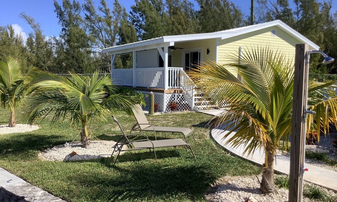 Bahama Reef Apartment | Cozy brand new yellow studio/cottage with free floating dock in Freeport.