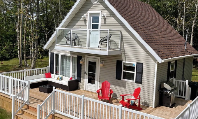 Borden-Carleton Cottage | Cozy cabin style cottage tucked into the woods with a view of the water.