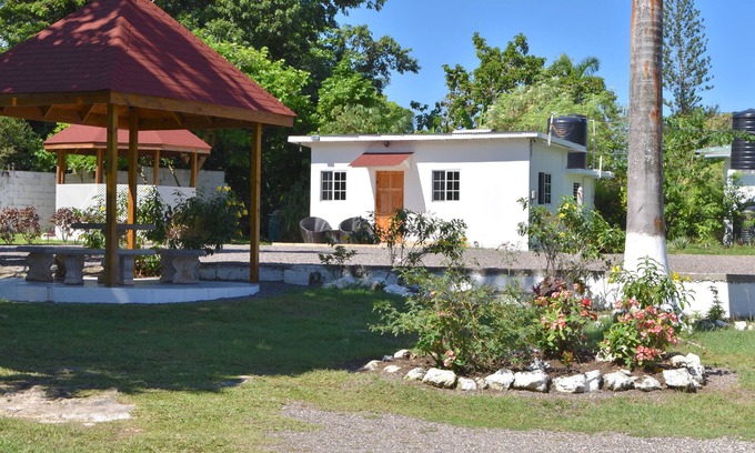 Mammee Bay Apartment | Cozy Cottage, 5 minutes walk to beach, beautiful garden perfect relaxation spot