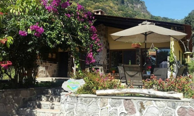 Panajachel Cottage | Cozy country cottage with wooden ceilings and stone walls within nature reserve.