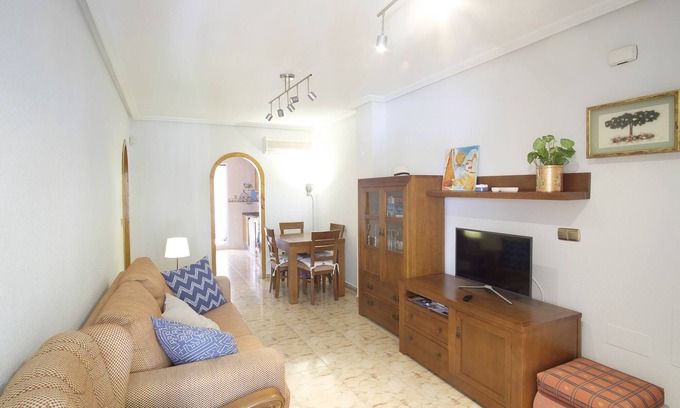La Marina Apartment | Cozy family apartment with patio and terrace and communal swimming pool