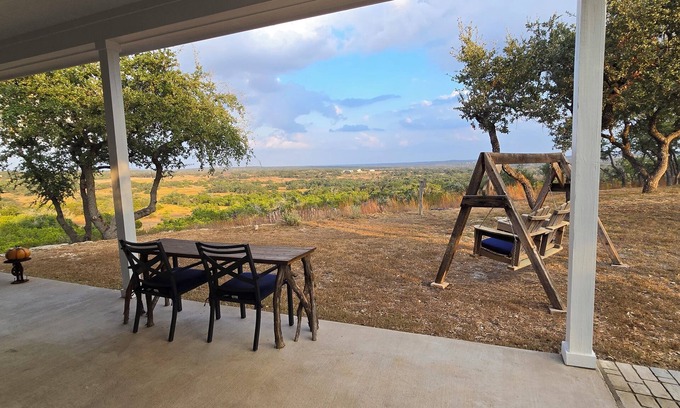 Dripping Springs Cottage | Cozy hilltop guesthouse at Barkspin Oaks Ranch. Beautiful views!