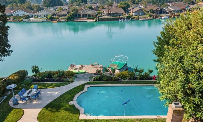 Stockton House | Cozy Home on a Lake and a sparkling pool with lush garden and Dock!