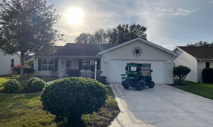 Lady Lake House | Cozy home w/golf cart, lanai, smart TVs, & prime location near town squares!