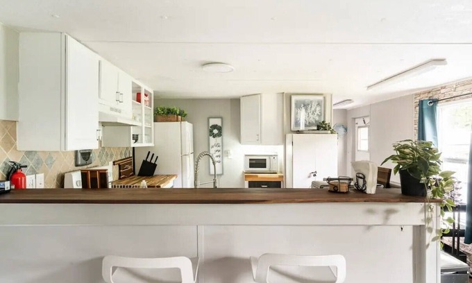 Danville House | Cozy home with butcher block counter tops, custom live-edge walnut bar top