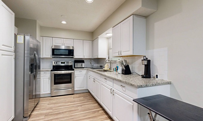Riverview House | Cozy home with large patio, sun room, private W/D, central AC, and WiFi