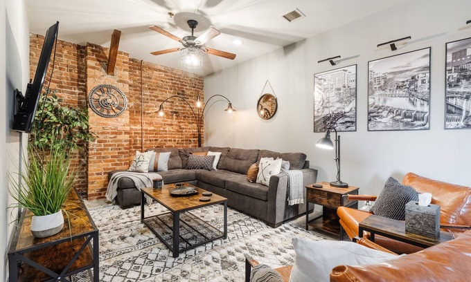 Greenville Downtown Apartment | Cozy Industrial 2-KING Bdrm S. Main Street Downtown Condo w/Foosball Table