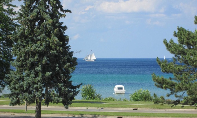 Traverse City Apartment | Cozy Modern Luxury Apartment with Beach Views -10 Min Walk Downtown