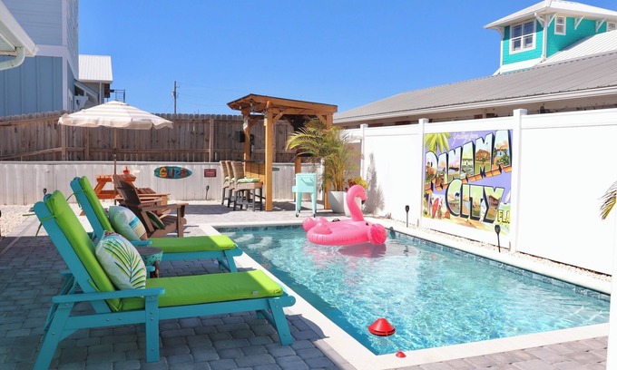 Bel Air House | Cozy Retreat , steps to the beach, heated pool , gulf views & huge party Deck