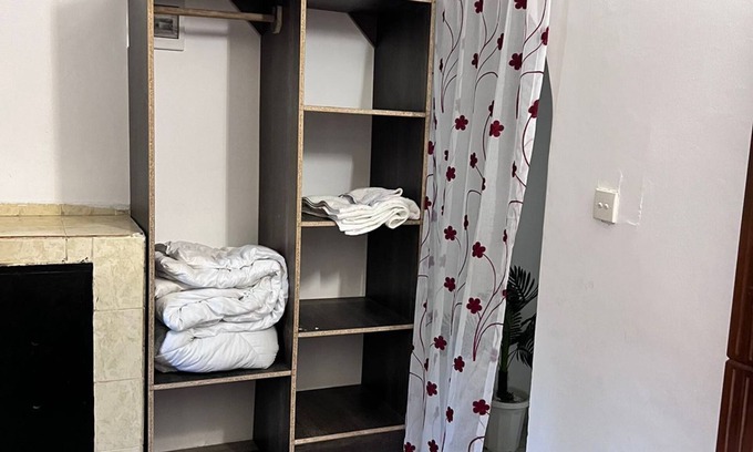 Mombasa Apartment | Cozy specious living room with a Tv for entertainment and free WiFi.