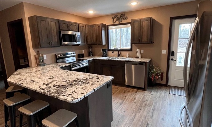 Bemidji House | Cozy two level home - 2 minutes from beach on private wooded lot.