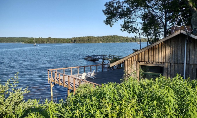 South Bristol Cabin | Cozy waterfront log cottage with huge outdoor living area.