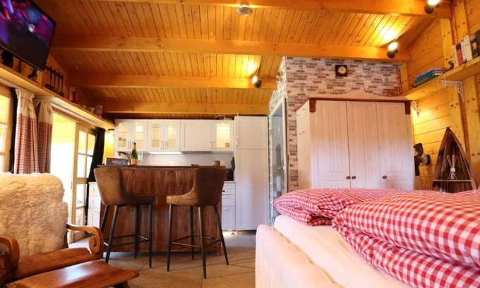 Neufeld House | Cozy wooden cottage quietly situated behind the dike with terrace