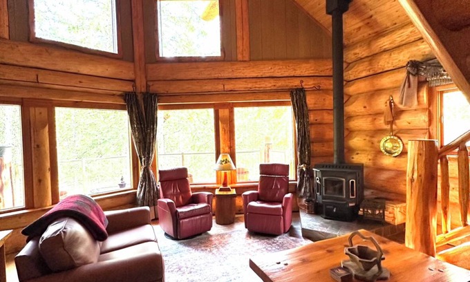 Crawford Bay Cabin | Creek side cabin in the woods with wood stove and deck - pet friendly!