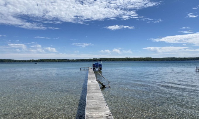 Lake Township House | Crystal Lake Waterfront Cottage with Private Dock, Yard, & Hot Tub