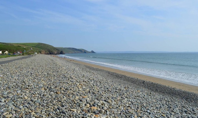 Roch House | Curlew Cottage - sea views, hot tub, walk to beach
