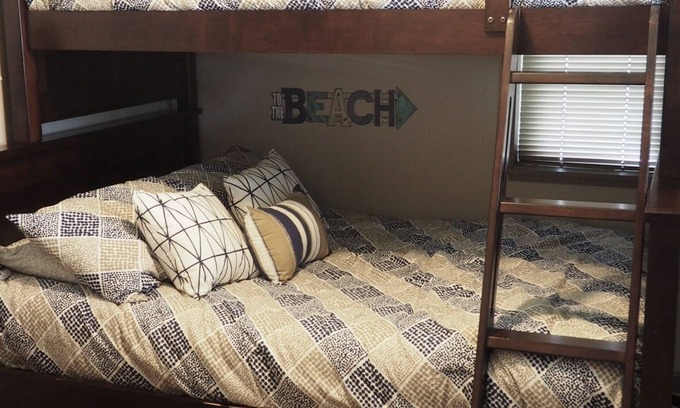 Cadillac House | Cute, Cozy Cottage walking distance to Lake Mitchell