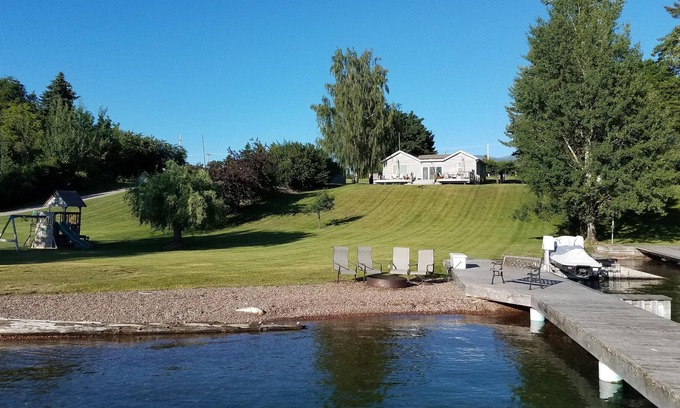 Polson Cottage | Daly Cottage Offers a Beach, Dock, Private Boat Ramp and is Pet Friendly!