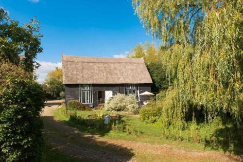 Stowmarket House | Deepwell Granary is a lovely thatched barn with attached meadow woodland
