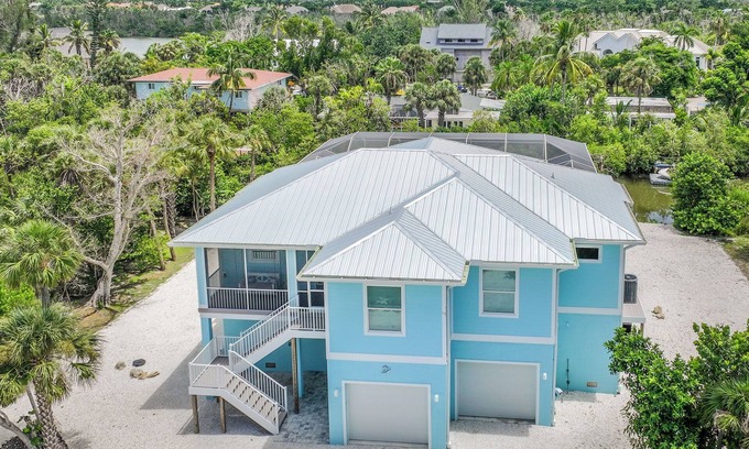 Sanibel House | DEJA BLUE | Lux Canal-Front Sanibel Home with Saltwater Pool and View