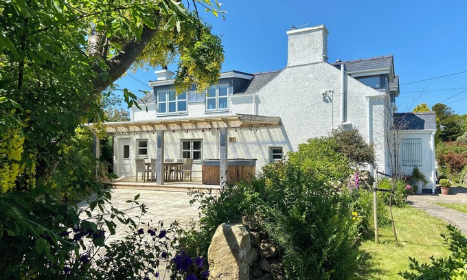 Mynytho Cottage | Delightful 3 bed cottage with hot tub, wood burning stove and sea views