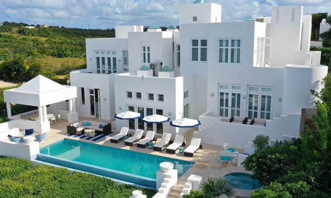 Long Bay Village Villa | Deluxe white 5 bedroom villa with sea view