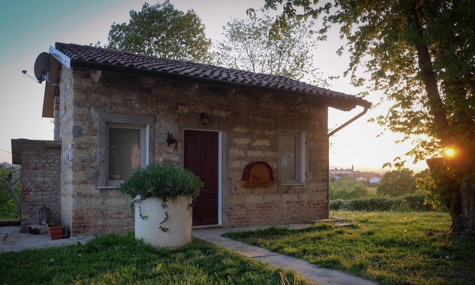 San Maurizio House | Dependance Rose, a romantic living room with double bed and bathroom
