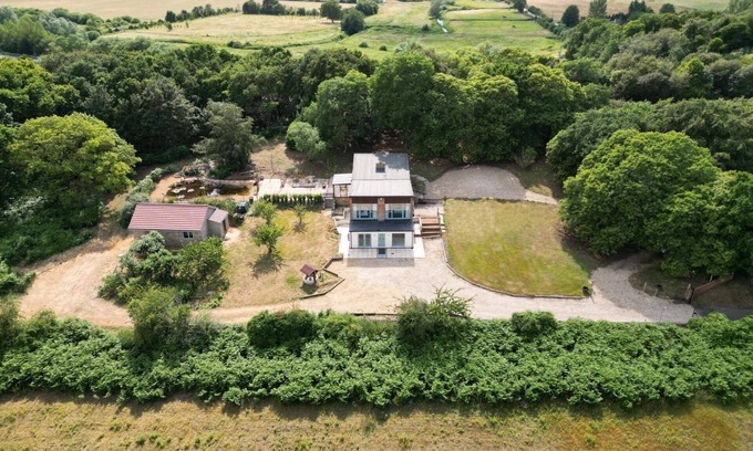 Bawburgh House | Detached property in woodland surrounding.