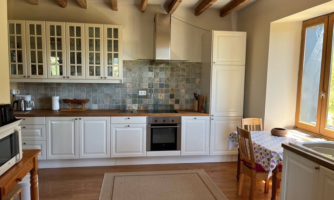 Compains Other | Distinctive farmhouse on a hillside with panoramic views over volcanic landscape