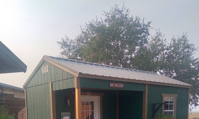 Imlay Cabin | Doc Holliday, has a double bed, sleeps 2 and has a detached private bathroom.