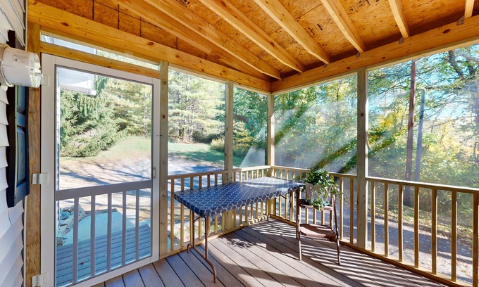 Newland House | Dog-friendly home with a deck, screened sunroom, washer/dryer, & AC