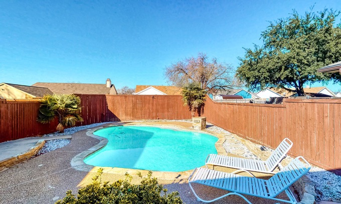The Colony House | Dog-friendly remodeled home with full kitchen, outdoor pool, & arcade games