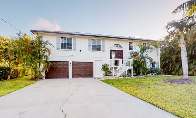 Redevelopment Area House | Dog-friendly waterfront home with extensive deck, canal views, lawn, W/D, AC