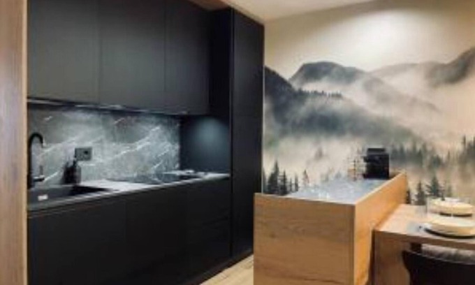 Tesero Apartment | Dolomiti Haus 300 ft from Pampeago ski lifts.
