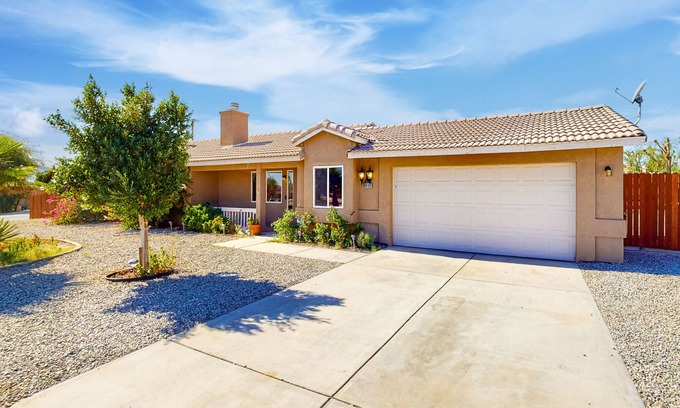 Desert Hot Springs House | Dreamy desert oasis with private yard, firepit, covered lanai, fireplace, & W/D
