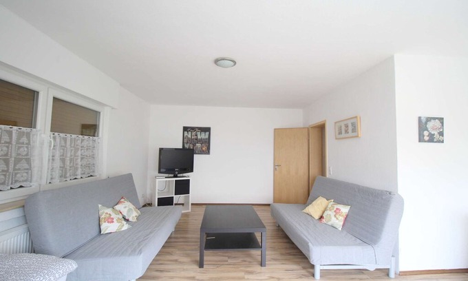 Eitorf Apartment | E06 Workers Apartment in a quiet location in Eitorf with a terrace with a seating area