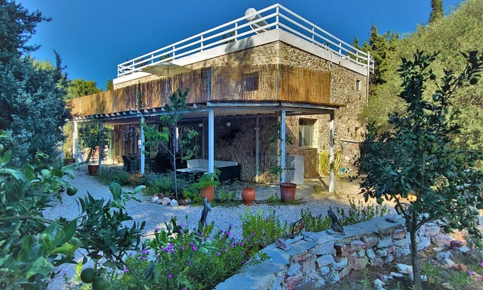 Mastichari House | Eco Secluded hand built stone house in an oasis