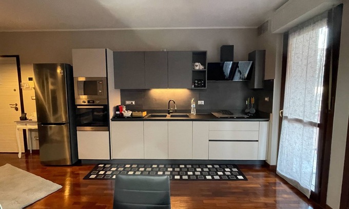 Santa Rita Apartment | Elegant apartment with private parking, a 5-minute walk from INALPI ARENA