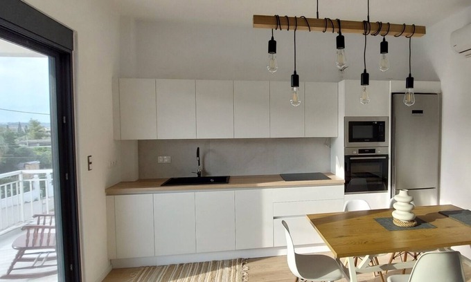 Kato Almiri Cottage | Elegant summer residence with big balcony and garden. Can host 8-10 adults.