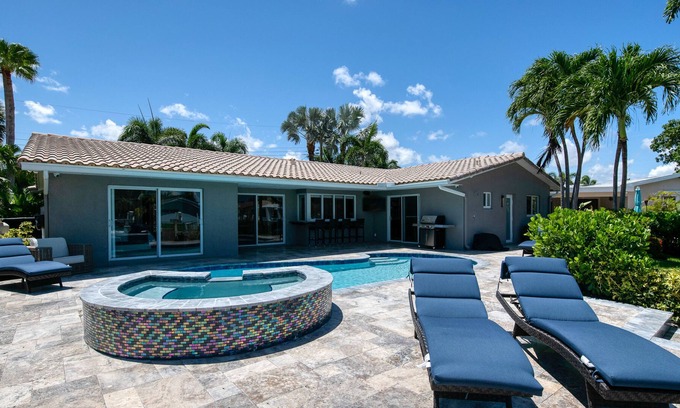 Garden Isles House | Enchanting waterfront home with pool, hot tub, playground, fast WiFi, & W/D