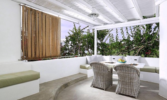 Apollonia Villa | Endearing Milos Suite | Cycladic Light Suite | Private Furnished Balcony | Outdoor Dining Area |.