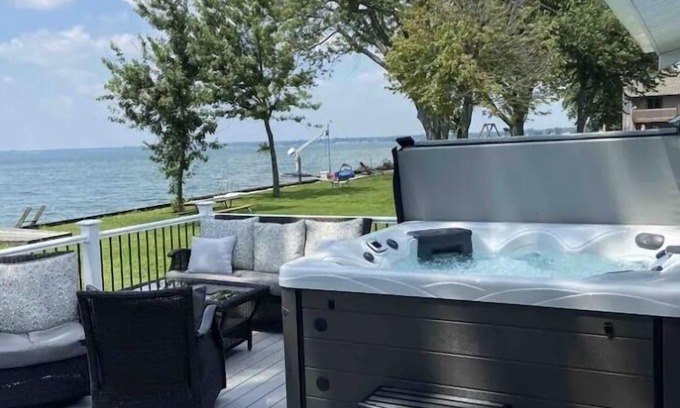 Fair Haven House | Enjoy Beautiful Sunsets at this Lake House w a HOT TUB, Boat Garage and Game Rm