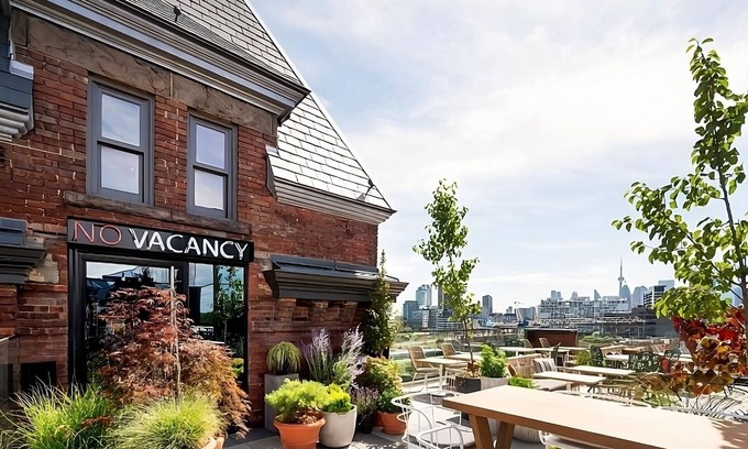 Riverside Hotel | Enjoy Skyline Views from the Rooftop Bar! 4 Comfortable Units, Coffeehouse