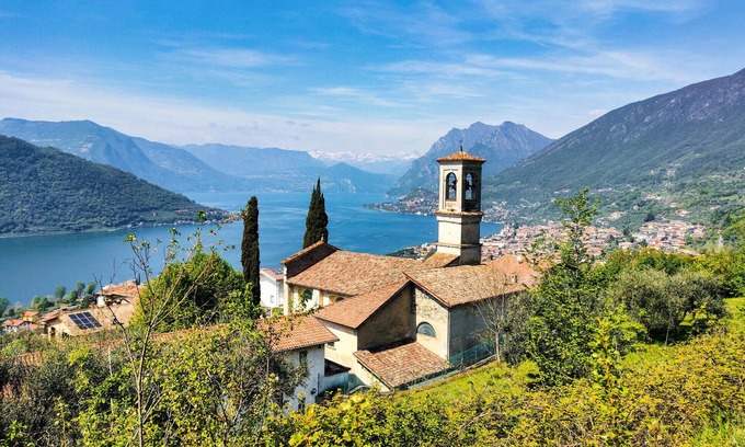 Sovere Apartment | Enjoy the beautiful view of the countryside and this comfortable vacation apartment.