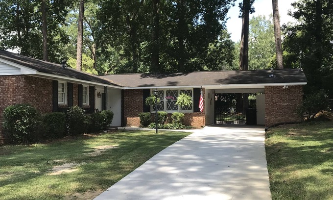 Augusta House | Enjoy the Master’s knowing the hot tub and private backyard await your return.