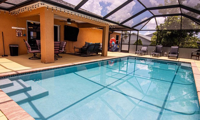 Diplomat House | Enjoy the Salt Life with this Heated Saltwater Pool and outdoor lanai.